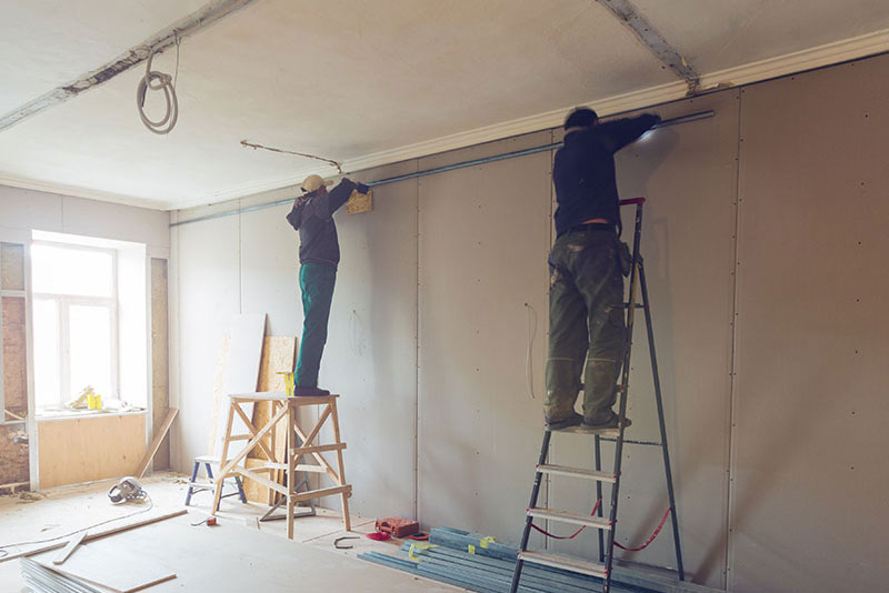 Triad workers remodeling home